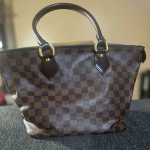 Authentic Louis Vuitton w/ built in cellphone holder inside